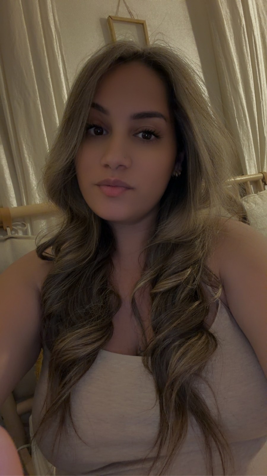 Happy client taking a selfie to show off her fresh salon transformation