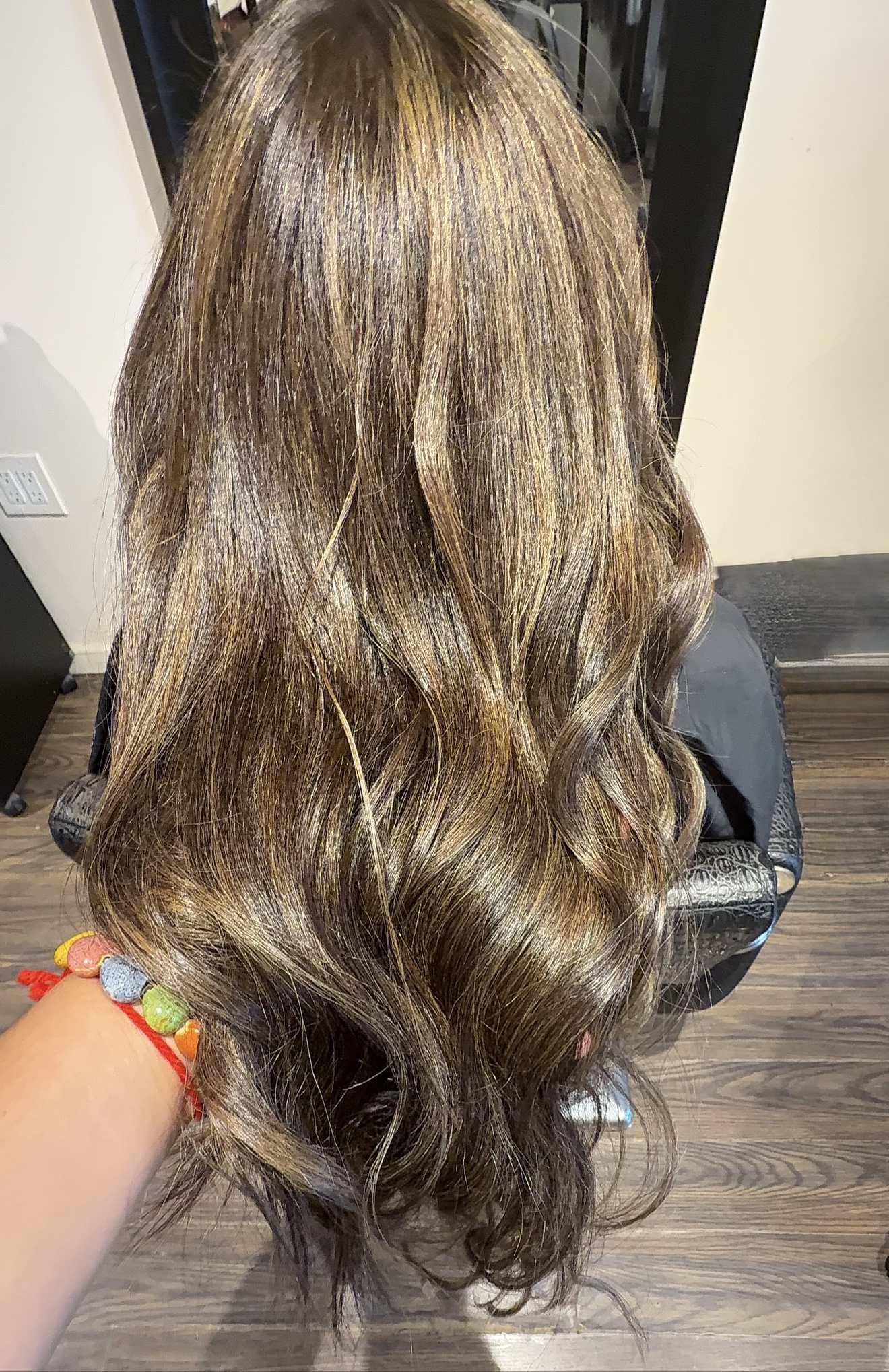 Long brunette hair with glossy dimensional highlights